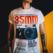 Load image into Gallery viewer, The Photographer Camera Shirt shows where it all started. Your not just someone using an camera phone for selfies. You have the eye, the vision for the perfect shot. You move in and push the subject out of dead center. You shoot on manual. You shoot in RAW. You're a true photographer. Experience the OldSkull Shirts quality. -OldSkull Store USA the best shirt store in North America.