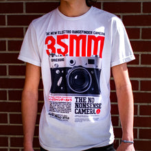 Load image into Gallery viewer, The Photographer Camera Shirt shows where it all started. Your not just someone using an camera phone for selfies. You have the eye, the vision for the perfect shot. You move in and push the subject out of dead center. You shoot on manual. You shoot in RAW. You're a true photographer. Experience the OldSkull Shirts quality. -OldSkull Store USA the best shirt store in North America.